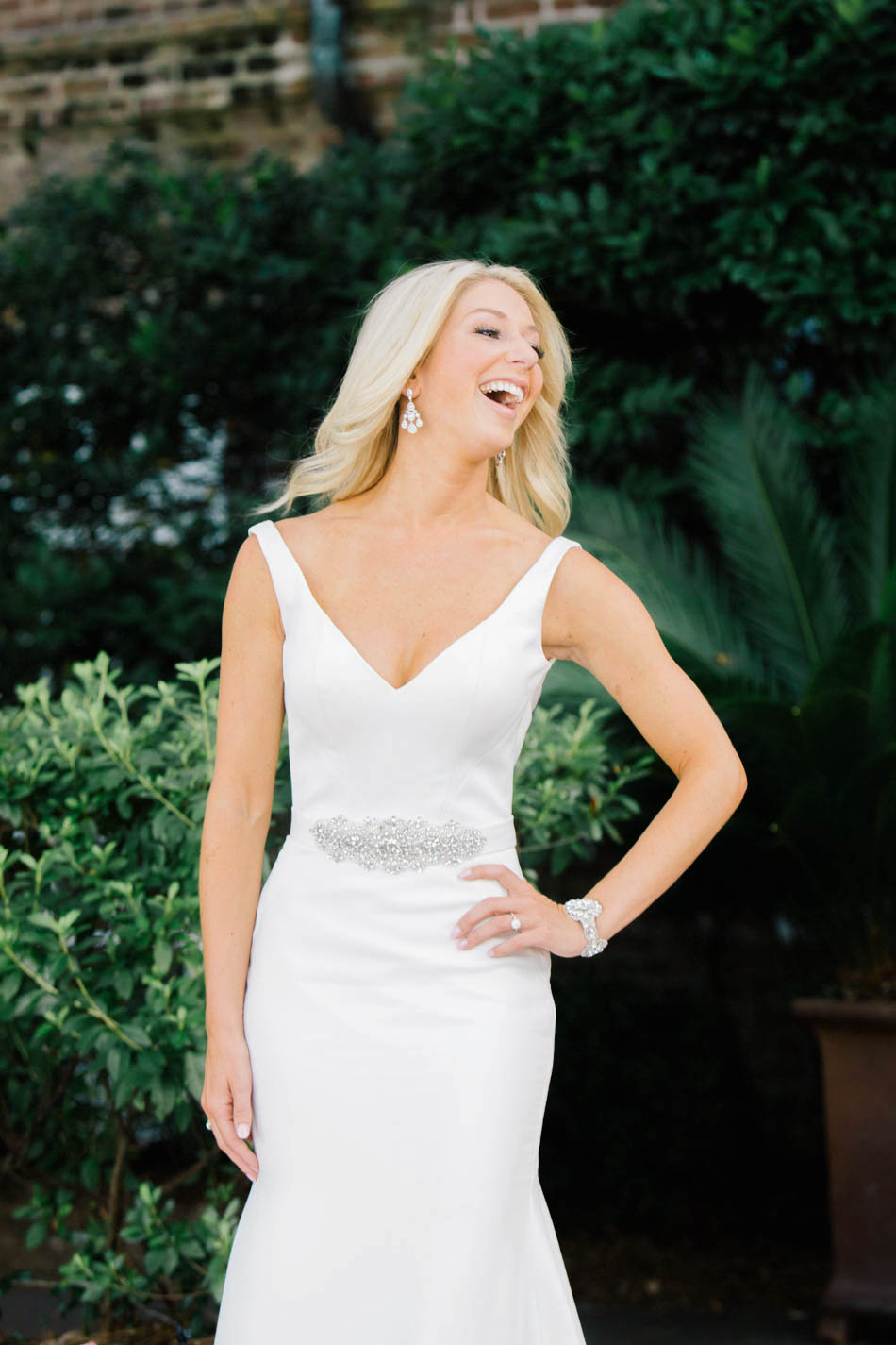 Bride smiles at the Rice Mill Building, Charleston, South Carolina Kate Timbers Photography. http://katetimbers.com #katetimbersphotography // Charleston Photography // Inspiration