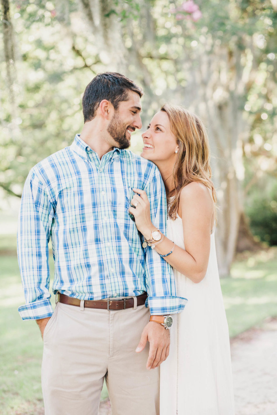 Engaged couple stands in clearing with spanish moss covered trees all around, Hampton Park, Charleston, South Carolina Kate Timbers Photography. http://katetimbers.com #katetimbersphotography // Charleston Photography // Inspiration